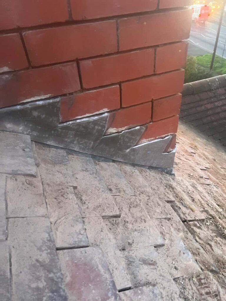 This is a photo of new leadwork being installed around an old chimney. Works carried out by Witchford Roofing Repairs